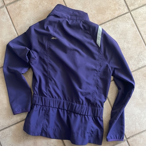 Reebok running jacket.Excellent condition.Dark purple, silver reflector strips. - Picture 2 of 2